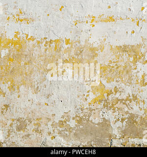 Abandoned grunge stucco wall. Peeling paint on wall Stock Photo