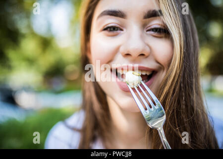 Beautiful healthy woman eating salad, Dieting Concept. Healthy Lifestyle. Stock Photo