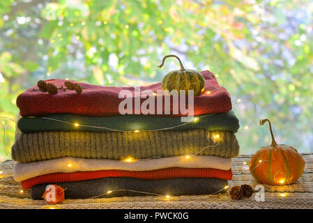 Autumn Pile of Warm knitted sweaters Stock Photo