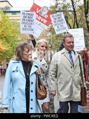 Conservative MP Craig Mackinlay (right), with his wife Kati Mackinlay (second left), arrive at Southwark Crown Court in London to face charges over his 2015 general election expenses. Stock Photo