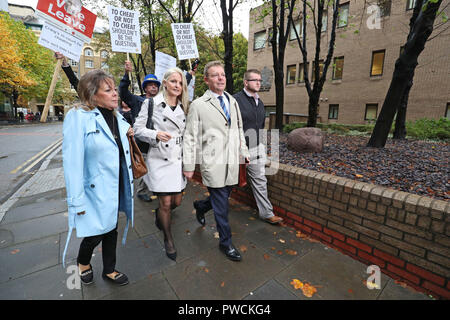 Conservative MP Craig Mackinlay (second right), with his wife Kati Mackinlay (second left), arrive at Southwark Crown Court in London to face charges over his 2015 general election expenses. Stock Photo