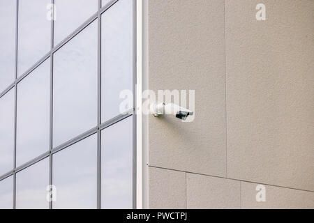CCTV video camera security system on the wall of the building Stock Photo
