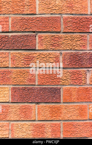 Old red bricks wall in sunlight, seamless background photo texture – portrait mode, vertical orientation Stock Photo