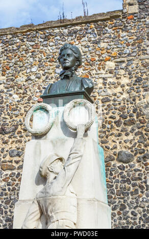 Memorial statue with head and shoulders bust of Edith Cavell, nurse, patriot and martyr by Norwich Cathedral, Norfolk, East Anglia, eastern England Stock Photo