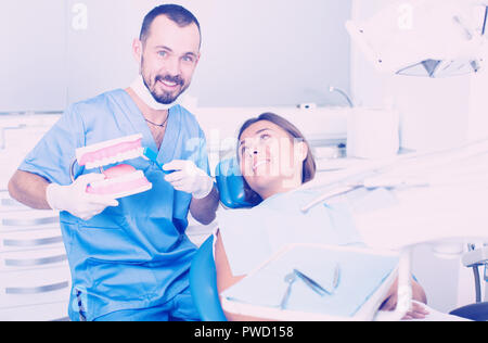 Orthodontist is telling about hygiene in hospital Stock Photo