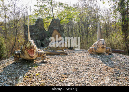 Big model of prehistoric dinosaur like dimetrodon grandis in nature. Realistic scenery.sunny day. Stock Photo