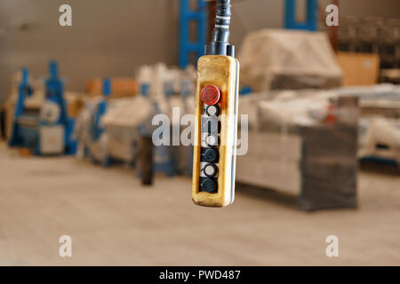 close up remote control switch for overhead crane in manufacture workshop Stock Photo