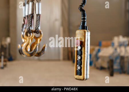 close up remote control switch for overhead crane in manufacture workshop Stock Photo