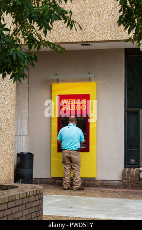 HICKORY, NC, USA-10/14/18: A man uses a Wells Fargo ATM. Stock Photo