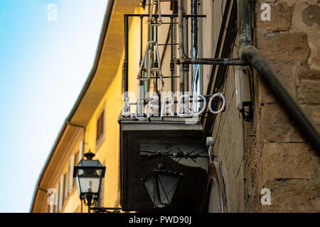 An unlit neon alfredo sign on the side of a building in Florence, Italy. Stock Photo