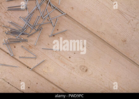 wooden hardware nails on rough surface Stock Photo