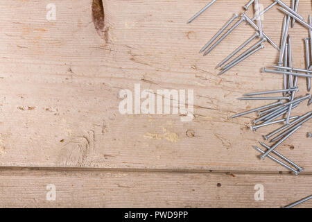 wooden hardware nails on rough surface Stock Photo