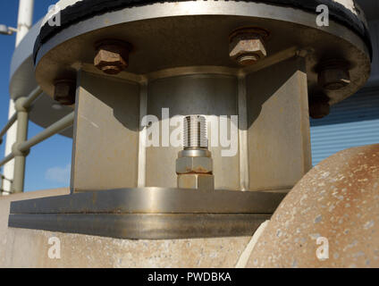 Stainless steel mounting plate fixed to concrete with stainless steel anchor  bolts, supporting Vertical axis wind turbine in Cleveleys lancashire uk Stock Photo