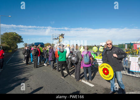 Blackpool, UK. 16th. October 2018: Anti-fracking protesters continued their protest against Cuadrilla as the company begins to frack the wells at their exploratory shale gas site beside Preston New Road, Little Plumpton near Blackpool.  Two protesters locked on to a device in the road at Wensley's farm who leased the land to Cuadrilla. The police closed the section of Preston New Road  causing motorists to divert to alternative routes. Credit: Dave Ellison/Alamy Live News Stock Photo