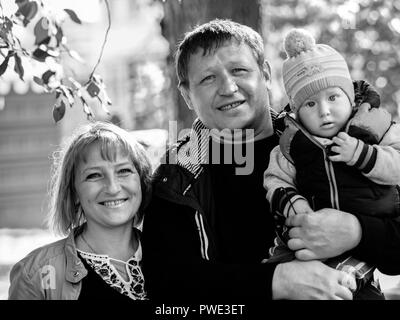 Boryspil, Ukraine. 14th Oct 2018. Modern Ukrainian family — The Protection of the Virgin is a national holiday celebrated by the Ukrainian Orthodox Church. On this day, at the same time, the holiday of the Ukrainian Cossacks, the Day of the creation of the Ukrainian Rebel Army and the Day of Defender of Ukraine are celebrated. Credit: Igor Golovnov/Alamy Live News Stock Photo