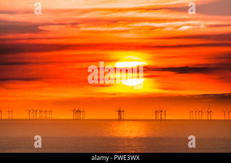 Eastbourne, East Sussex, UK..15 Octuber 2018..Stunning sunset over E.ON Rampion offshore wind farm in the English Channel off the Sussex coast. Picture taken from Beachy Head area. Stock Photo