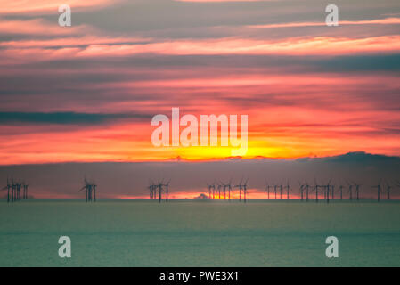 Eastbourne, East Sussex, UK..15 Octuber 2018..Stunning sunset over E.ON Rampion offshore wind farm in the English Channel off the Sussex coast. Picture taken from Beachy Head area. Stock Photo