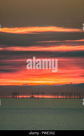 Eastbourne, East Sussex, UK..15 Octuber 2018..Stunning sunset over E.ON Rampion offshore wind farm in the English Channel off the Sussex coast. Picture taken from Beachy Head area. Stock Photo