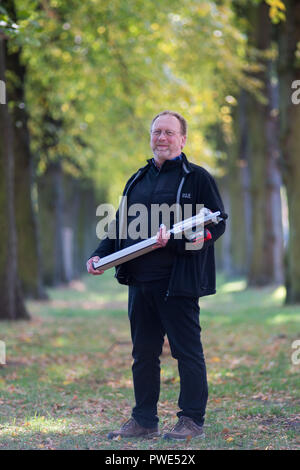 11 October 2018, Saxony-Anhalt, Magdeburg: Jörg Vollbrecht, expert for traffic safety, tree value determination and tree register of the company Klaus und Partner stands in the Rotehornpark with a drilling resistance meter in an avenue. (to "Increased tree mortality in Saxony-Anhalt feared after drought-summer" of 16.10.2018) Photo: Klaus-Dietmar Gabbert/dpa-Zentralbild/ZB Stock Photo
