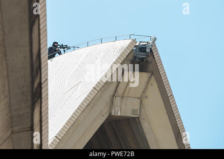 Sydney, Australia. 16th Oct 2018. Police sniper on the roof of The Opera House during Prince Harry and Meghan Markle's visit, Sydney. The royal pair watched a Bangarra Dance Company rehearsal. Credit: Paul Lovelace/Alamy Live News Stock Photo