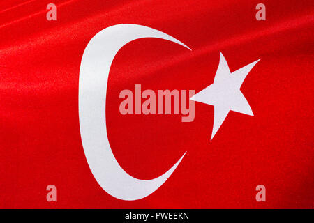 A large red and white Turkish flag blowing in the wind on a sunny day, Istanbul, Turkey Stock Photo