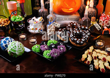 Buffet table with sweets and drinks, cooked  and decorated in honor of Halloween Stock Photo