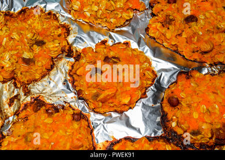 Baked in foil cakes from pumpkin and oatmeal Stock Photo