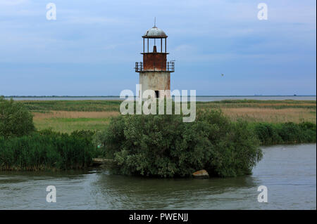 Romania, Tulcea County, Dobrudja, Dobruja, Danube Delta, Biosphere Reserve Danube Delta, river delta, estuary, Danube river mouth to the Black Sea, Old Lighthouse in Sulina at the Sulina branch, river bank, river landscape, Danube landscape, UNESCO World Heritage Site, natural landmark Stock Photo