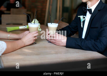 Coffee time, coffee break. Wedding day. Couple in cafe Stock Photo