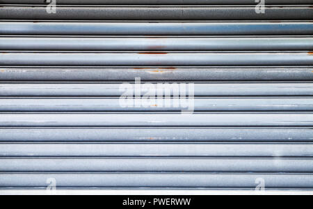 Shiny metal wall background texture, roller shutter door front view Stock Photo
