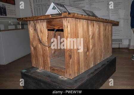 A guard dog house used on the Berlin Wall separating East and West Berlin between 1961-1989. Now displayed in the Mauermuseum Berlin. Stock Photo