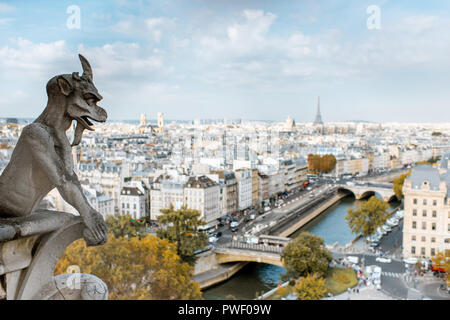 Aerial panoramic view of Paris with gargoyle sculpture on the Notre-Dame cathedral during the morning light in France Stock Photo