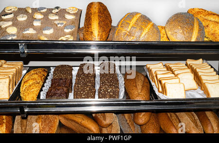 bakery shopping, Top view of assortment of different kind of cereal breads, many mixed bread with poppy, seeds, sesame and grains Stock Photo