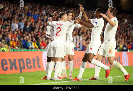 England's Raheem Sterling (left) celebrates scoring his side's first goal of the game during the Nations League match at Benito Villamarin Stadium, Seville. Stock Photo