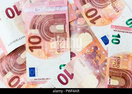 Several 10 euro banknote scattered on a table Stock Photo