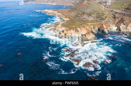 The cold, nutrient-rich waters of the North Pacific Ocean wash against the rocky and scenic coastline of Northern California not far from Monterey. Stock Photo