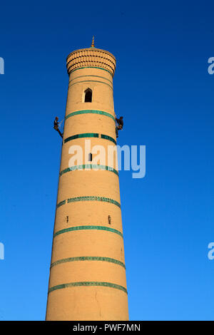 Uzbekistan, Khiva, Juma Mosque, minaret, workers, Stock Photo