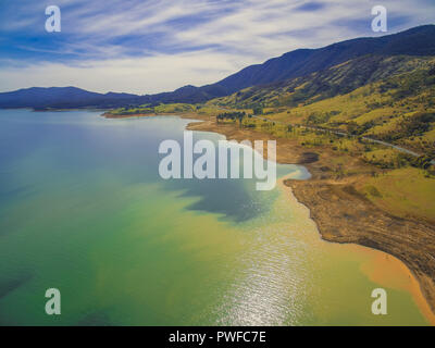 Tumut river coastline and rural highway in mountains. NSW, Australia Stock Photo