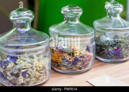 Different Flavor Flower Tea in glass jars, Dried Flowers. Organic Herbal Tea. Organic tea Stock Photo