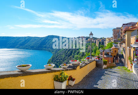 Castelgandolfo, Italy - April 21, 2017: Panoramic view of the village overlooking the volcanic Albano lake Castelgandolfo, Italy - April 21, 2017: Panoramic view of the village overlooking the volcanic Albano lake