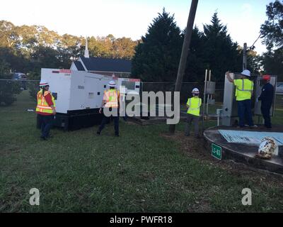 The first emergency generator in USACE's Emergency Power Mission in Georgia was installed last night and is supporting critical wastewater infrastructure in Albany with emergency temporary power while the larger commercial grid continues to be restored, October 13, 2018. Shown: Emergency Power Planning and Response Team personnel from the Savannah District oversee the installation. The Emergency Power Mission is being managed by the U.S. Army Corps of Engineers there in support of FEMA Federal Emergency Management Agency as part of the larger federal response to Hurricane Michael. (Photo by Ch Stock Photo