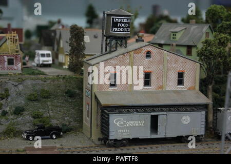 Really fantastic model railroading design with Imperial Food Products water tank and Garfield Central rail car in the Clarendon Garfield field house. Stock Photo