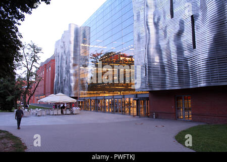 Interesting metal facade of Old Brewery (Stary Browar) converted into shopping mall, Poznan, Poland Stock Photo