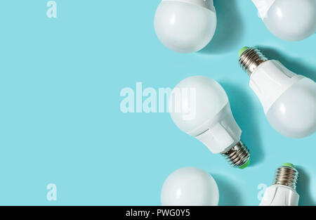 LED light bulbs on blue color background. Flat lay. Pattern. Copy space Stock Photo