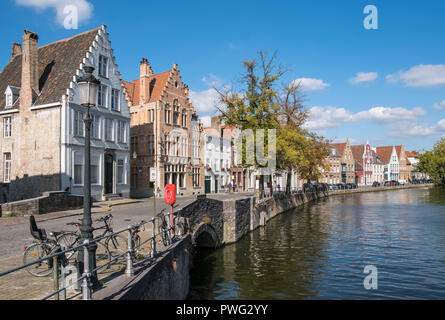 Street scene of canal waterfront housing in the historic city of Bruges, Flanders, Belgium Stock Photo