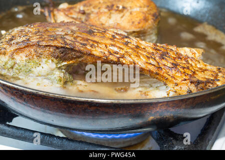 https://l450v.alamy.com/450v/pwg45a/river-bream-fish-is-frying-on-the-pan-in-oil-pwg45a.jpg