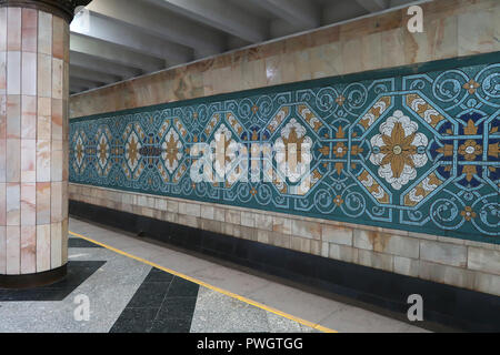 Murals from the Soviet era decorating Pakhtakor Station dedicated to the cotton industry at the Tashkent underground Metro in Uzbekistan. The Tashkent Metro built in the former USSR is one of only two subway systems currently operating in Central Asia and its stations are among the most ornate in the world. Stock Photo