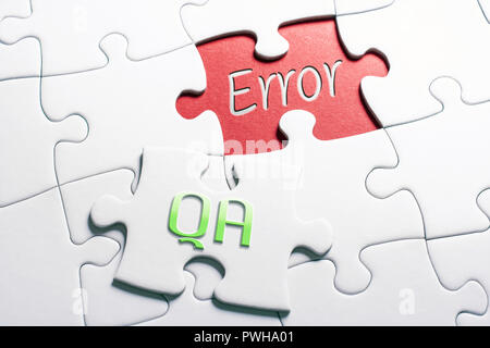 The Words QA And Error In Missing Piece Jigsaw Puzzle Stock Photo