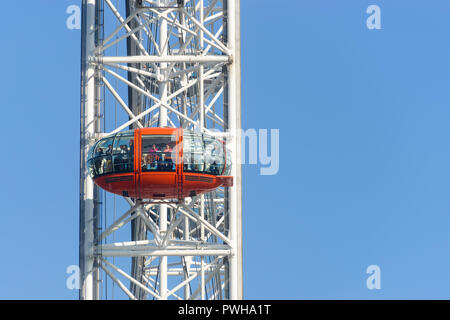 LONDON, UK - CIRCA OCTOBER 2012: People enjoying the view over London from the London Eye red capsule. Stock Photo