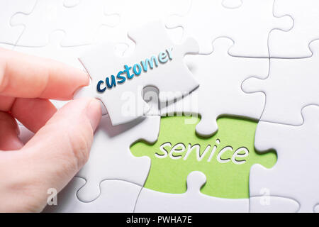 The Words Customer And Service In Missing Piece Jigsaw Puzzle Stock Photo